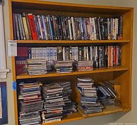 Full bookshelf view showing DVDs, CDs and VHS tapes