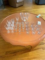 Full lot of mixed etched crystal stemware arranged on table