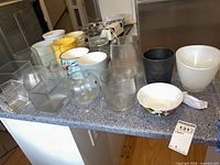 Group shot of all vases, planters and containers on countertop