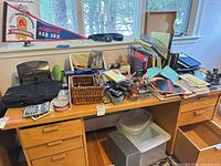 Wide view of desk showing majority of office supplies