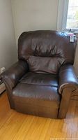Front view of dark brown power recliner chair