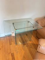 Overall view of glass table beside sofa