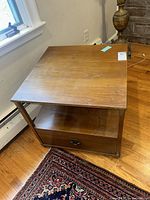 Full view of side table showing top, shelf, drawer