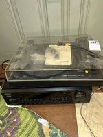 Yamaha PF-20 turntable stacked on Onkyo receiver, overall view shows dust cover and cables