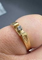 Close-up of diamond and setting on gold ring