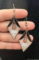 Front view of both earrings showing overall design and materials