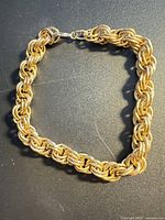 Full view of gold-tone rope chain bracelet