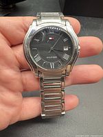 Front view of Tommy Hilfiger wristwatch showing dial, case and bracelet