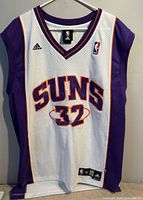 Front view of Adidas Shaquille O’Neal Phoenix Suns Swingman jersey showing overall design and logos