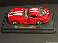 Top angled view of the red Dodge Viper model on Burago base