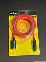 Front of sealed Nilight 14 ft cigarette lighter extension cord in packaging