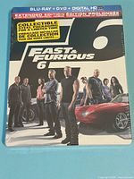 Front view of sealed Fast & Furious 6 steelbook showing cast cover and format labels