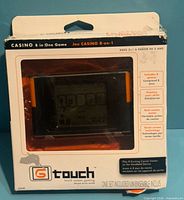 Front of sealed box showing G Touch Casino 8-in-1 game