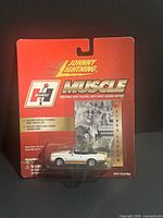 Front view of sealed Johnny Lightning Muscle Linda Vaughn car in blister pack