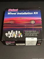 Front view of sealed McGard 84537 premium wheel installation kit box