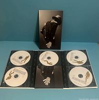 Closed box and full interior digipack displaying five CDs and booklet compartment