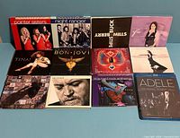All twelve CD albums fronts displayed in two rows