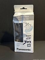 Front of sealed Panasonic TY-EW3D3MU 3D glasses box showing model, weight and size