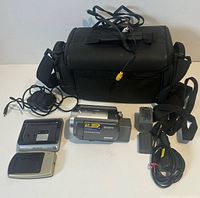 Complete lot showing camcorder, batteries, chargers, AV cable and carry case