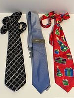 Three neckties laid flat showing full design