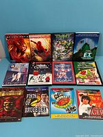 All 12 DVD cases laid out in three rows of four