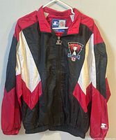 Front view of Starter Bulls Grey Cup Hamilton windbreaker hanging on hanger