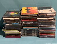 Stacked view of all CD jewel cases showing volume of collection