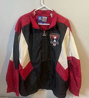 Front view of Starter Grey Cup Hamilton windbreaker on hanger