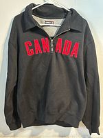 Front view of Kodiak quarter-zip CANADA sweatshirt