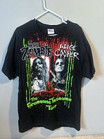 Front of black Rob Zombie Alice Cooper Gruesome Twosome Tour T-shirt on hanger