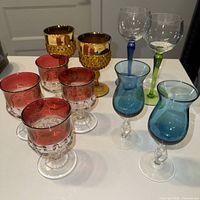 Group shot of all 11 vintage glasses on table