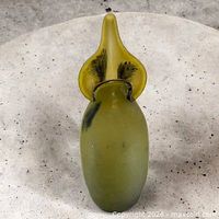Front view of tall frosted green satin glass vase