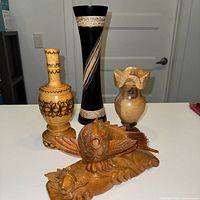 All four carved wooden items together