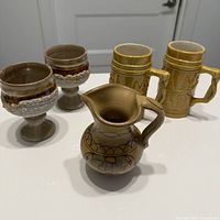 Group view: two goblets, two mugs, one pitcher