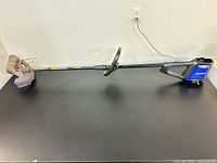 Full view of Kobalt cordless string trimmer showing straight shaft and cutting head