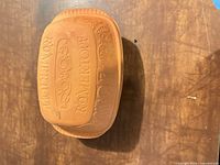 Closed Romertopf clay baker showing embossed lid