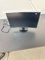 Front view of Samsung 24-inch curved monitor on stand