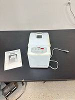 Bread machine with manual on table