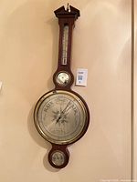 Full view of banjo barometer on wall
