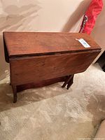 Table folded with both leaves down showing side profile