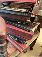Stack of bound classical record albums showing titles and worn covers