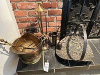 Overall view of coal bucket, two tool sets, and log holder