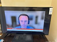 Front view of Hisense TV powered on showing BBC News