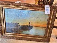 Full view of framed oil painting showing landscape scene and ornate frame