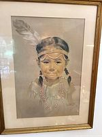 Full view of framed pastel portrait under glass
