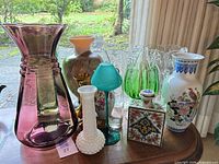 Group view of all vases and decorative items on table
