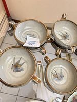 Group of handled bowls showing interiors and handles