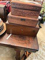 Three stacked wooden boxes showing size comparison and front details