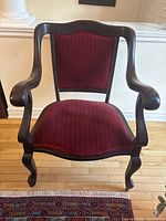 Front view showing wood frame, upholstery, leg style