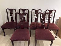 Front view of all six chairs showing upholstery and design